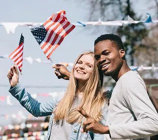 multiethnic-man-woman-with-american-flags